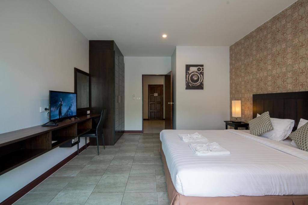 Postel nebo postele na pokoji v ubytování Amarin Hotel Patong