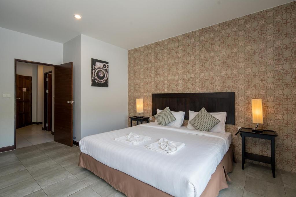 Postel nebo postele na pokoji v ubytování Amarin Hotel Patong