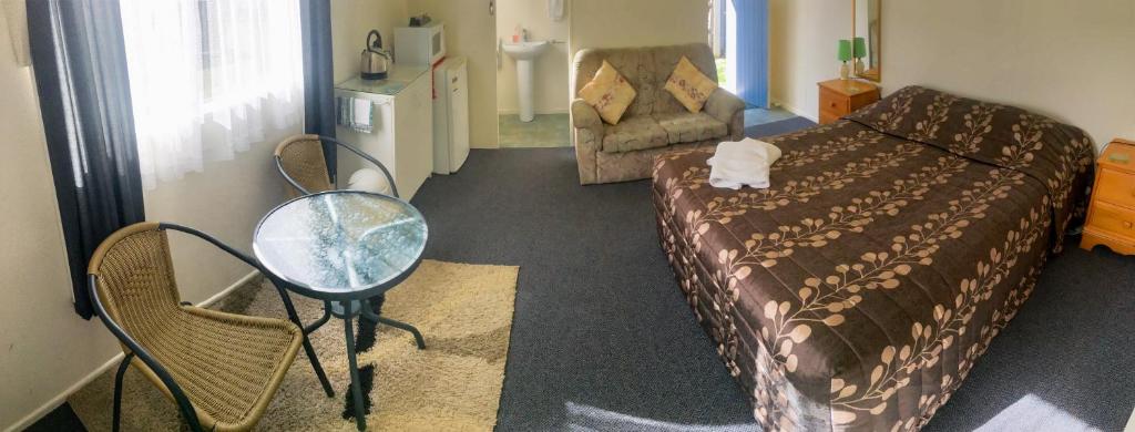 Postel nebo postele na pokoji v ubytování Alma Motel