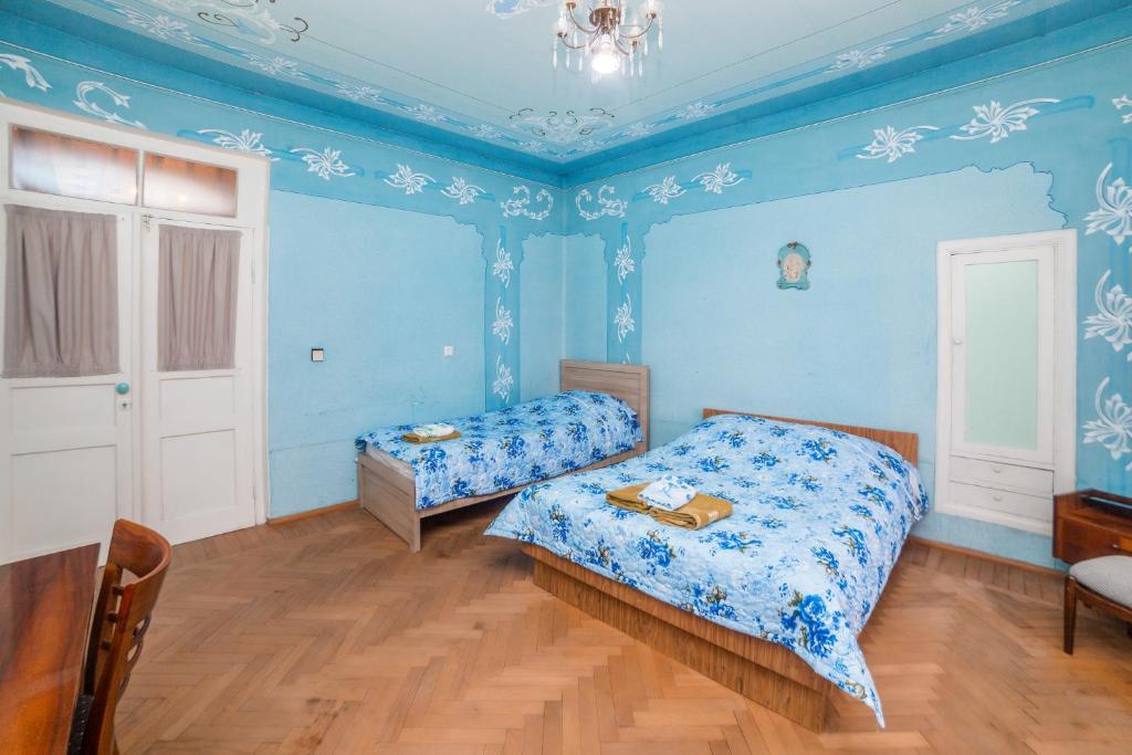 Postel nebo postele na pokoji v ubytování Nukri Guest House