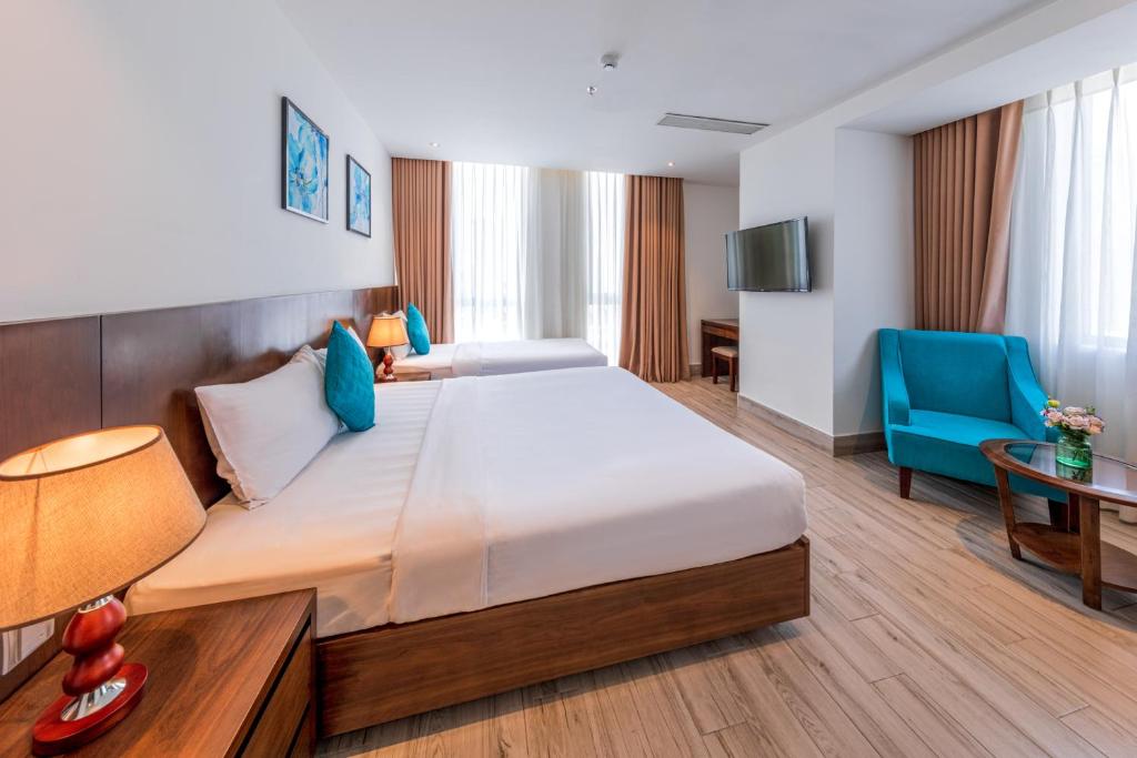 Postel nebo postele na pokoji v ubytování Greenery Hotel