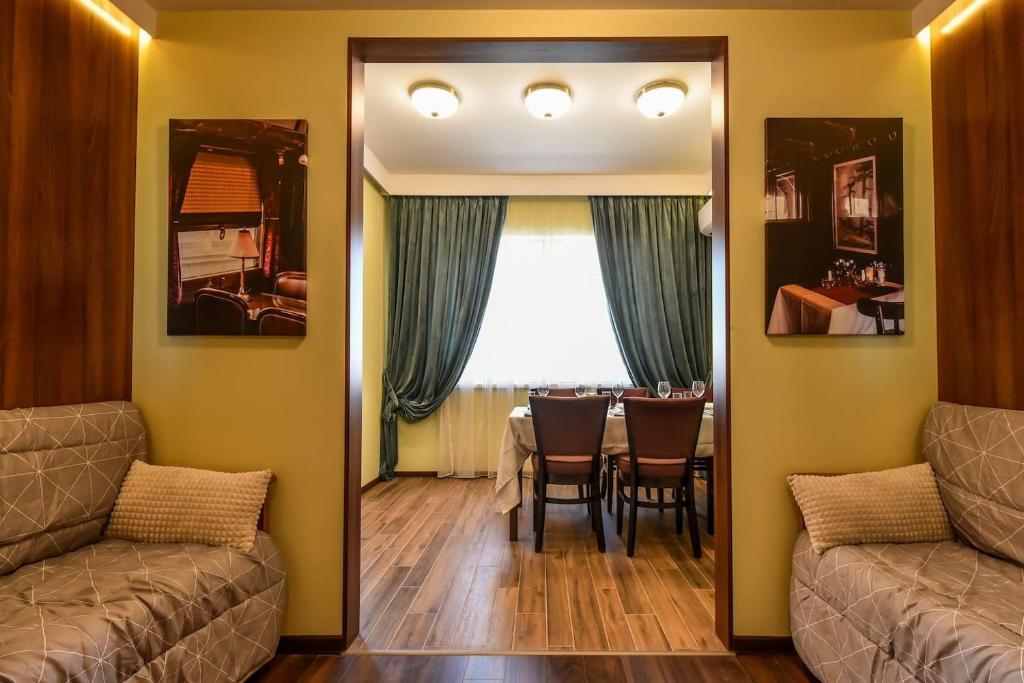 A seating area at Palace of Culture 2-Bedroom Retreat on Skobelev blvd