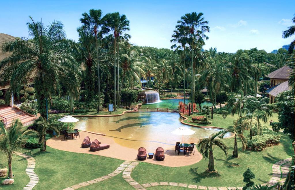 an aerial view of a resort pool with a waterfall at Cyberview Resort & Spa in Cyberjaya