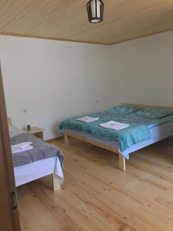 Postel nebo postele na pokoji v ubytování GUEST HOUSE ,, MEMORY''