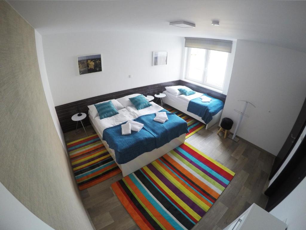 Postel nebo postele na pokoji v ubytování Apartmány ROSE Lednice