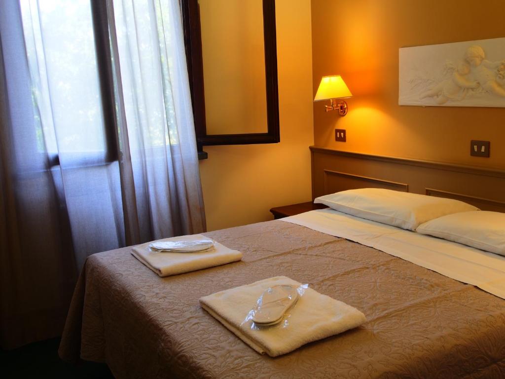 Posteľ alebo postele v izbe v ubytovaní Hotel Parco Fola