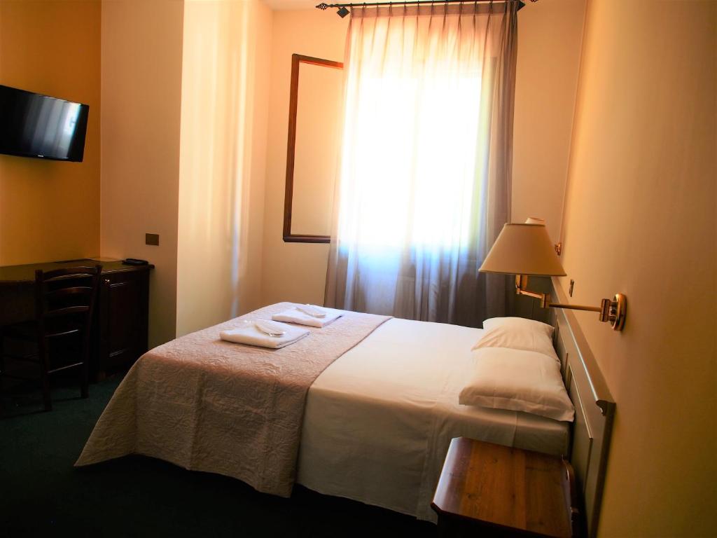 Posteľ alebo postele v izbe v ubytovaní Hotel Parco Fola
