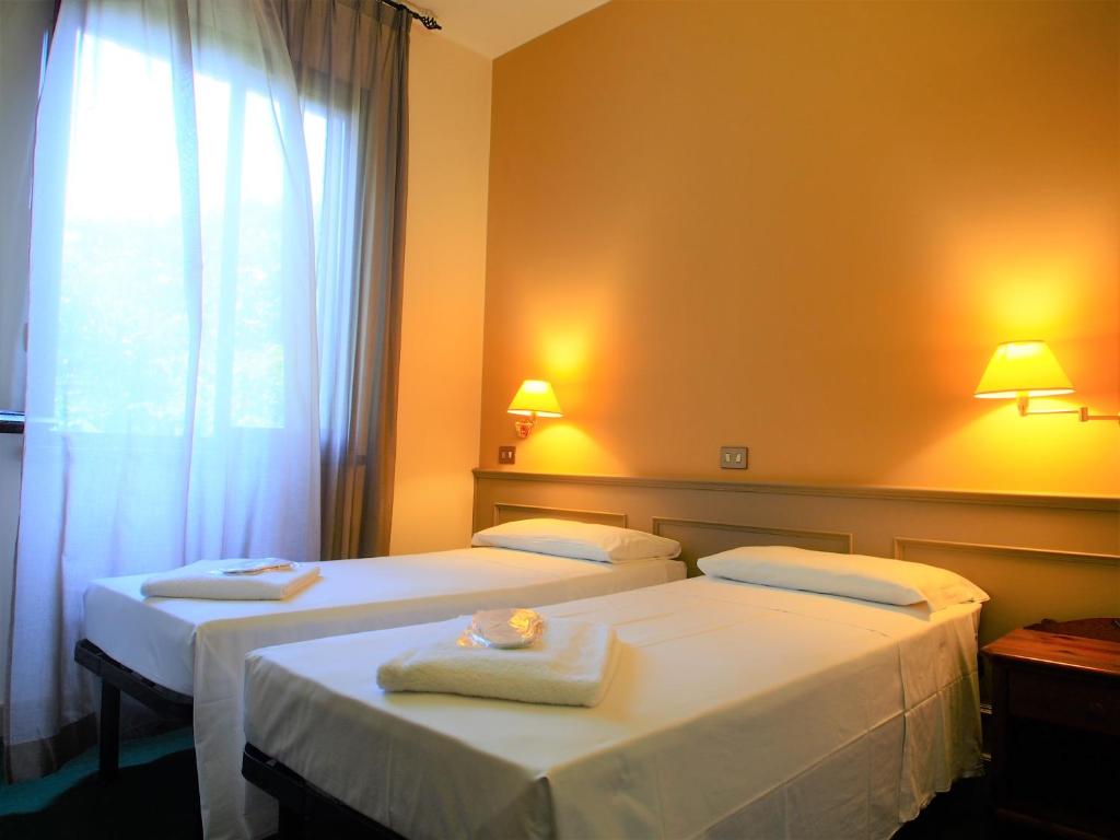 Posteľ alebo postele v izbe v ubytovaní Hotel Parco Fola