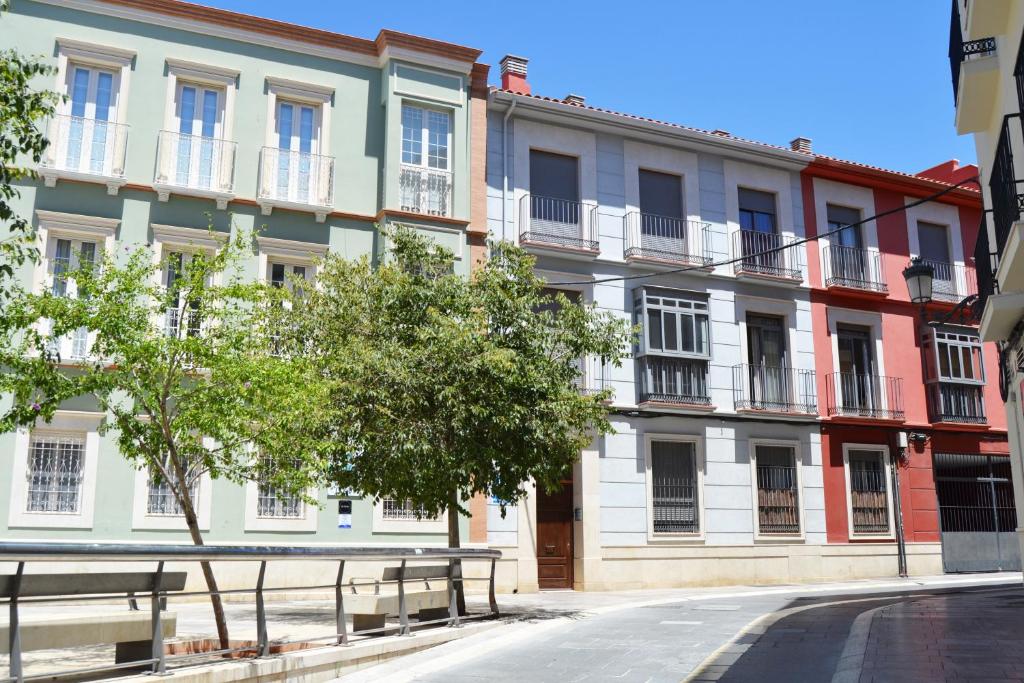 an empty street in front of a building at Apartamento Barrio Picasso in Málaga