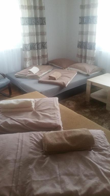 Postel nebo postele na pokoji v ubytování Apartmány u Galandu