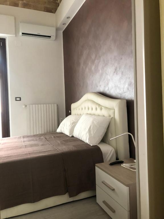 Łóżko lub łóżka w pokoju w obiekcie B & B Via Cavour