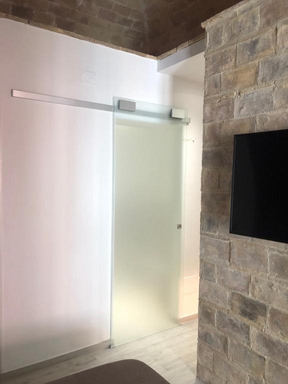 Telewizja i/lub zestaw kina domowego w obiekcie B & B Via Cavour