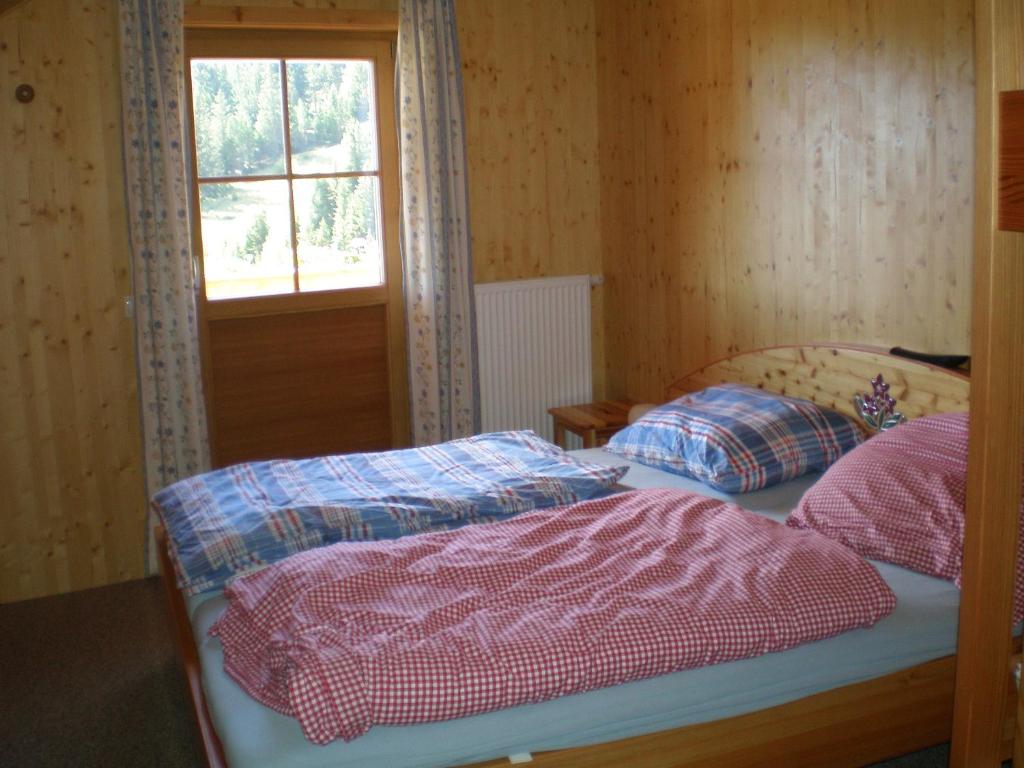 Posteľ alebo postele v izbe v ubytovaní Almrauschhütte Markus