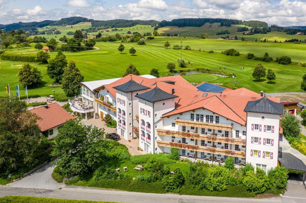 an aerial view of a resort with a golf course at Hanusel Hof Wellness & Genuss in Panoramalage in Hellengerst