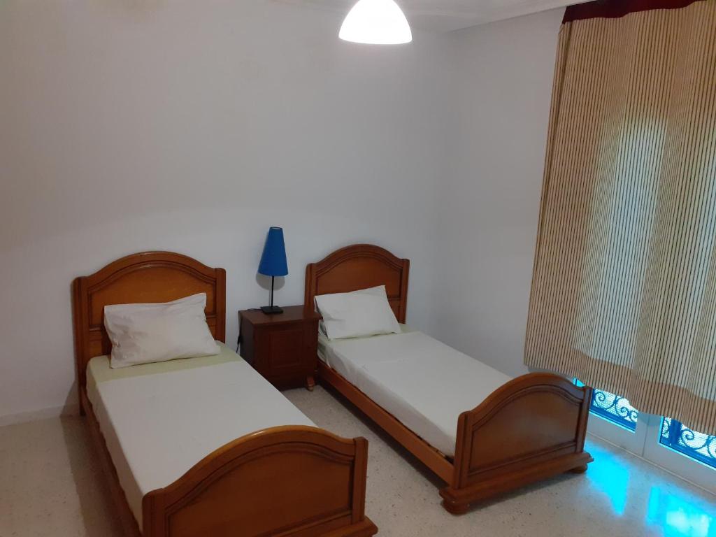 Postel nebo postele na pokoji v ubytování Villa Bougainvillier