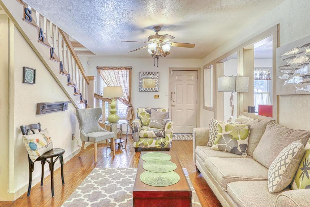 a living room with a couch and chairs at Taylor Cottage in Savannah