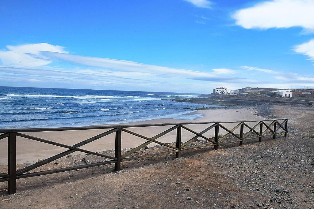 a view of a beach with the ocean at Cozy House 5 min from the Historic Center of Galdar in Gáldar