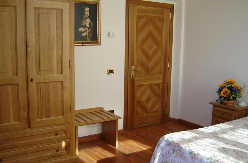 Postel nebo postele na pokoji v ubytování Hotel La Rosa