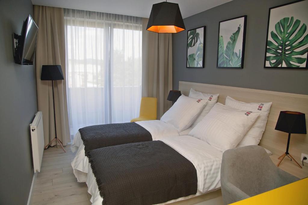 Postel nebo postele na pokoji v ubytování B&B ALIBI