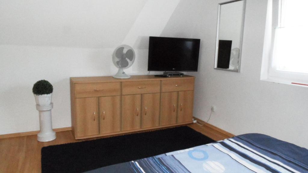 Televízia a/alebo spoločenská miestnosť v ubytovaní Ferienhaus am Plattensee