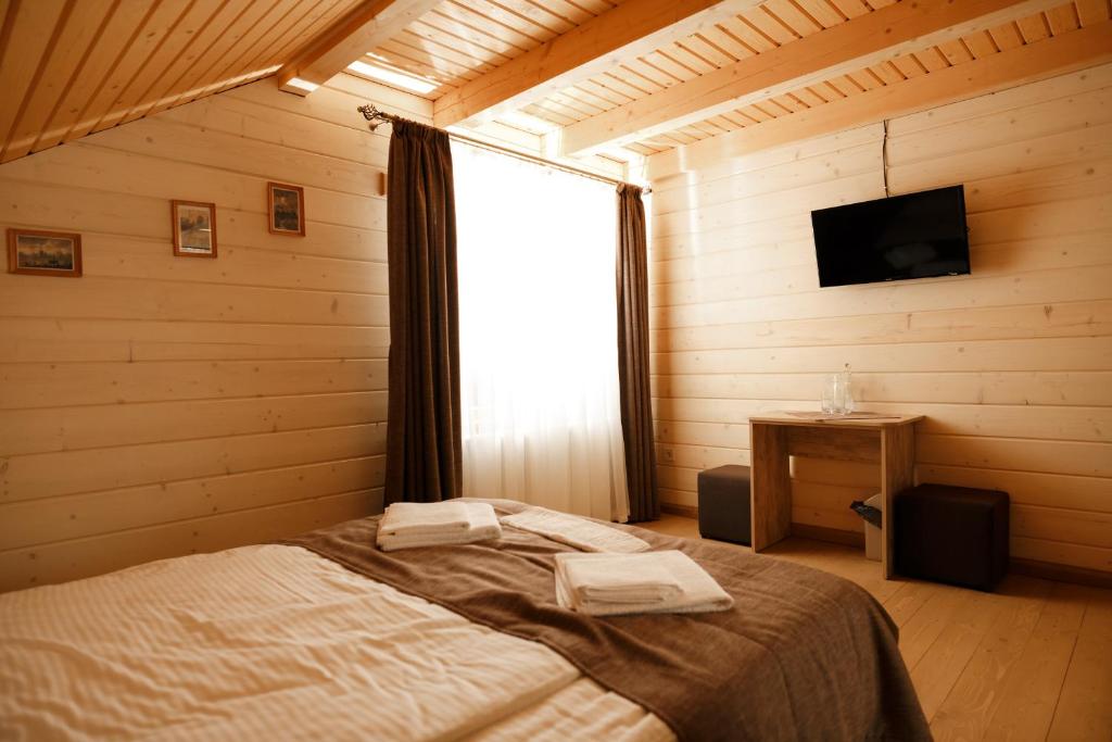 Postel nebo postele na pokoji v ubytování GUTSULWOOD