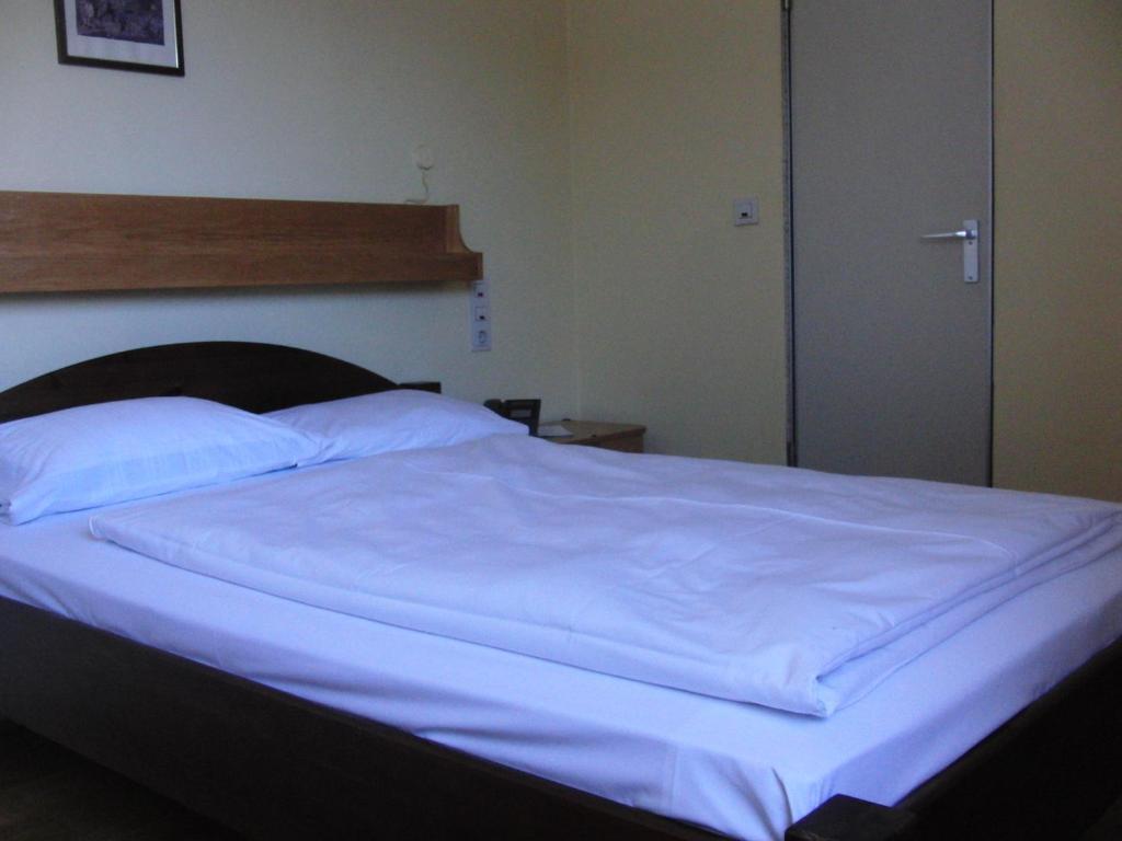 Postel nebo postele na pokoji v ubytování Hotel Angerer