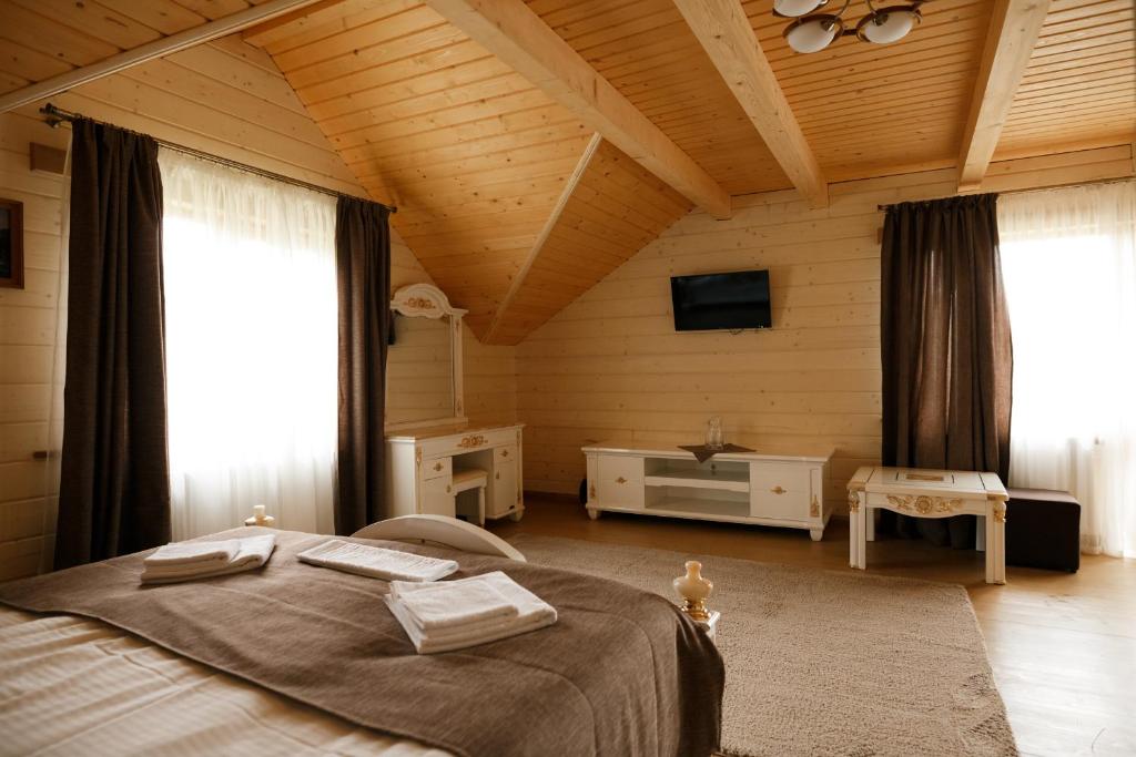 Postel nebo postele na pokoji v ubytování GUTSULWOOD