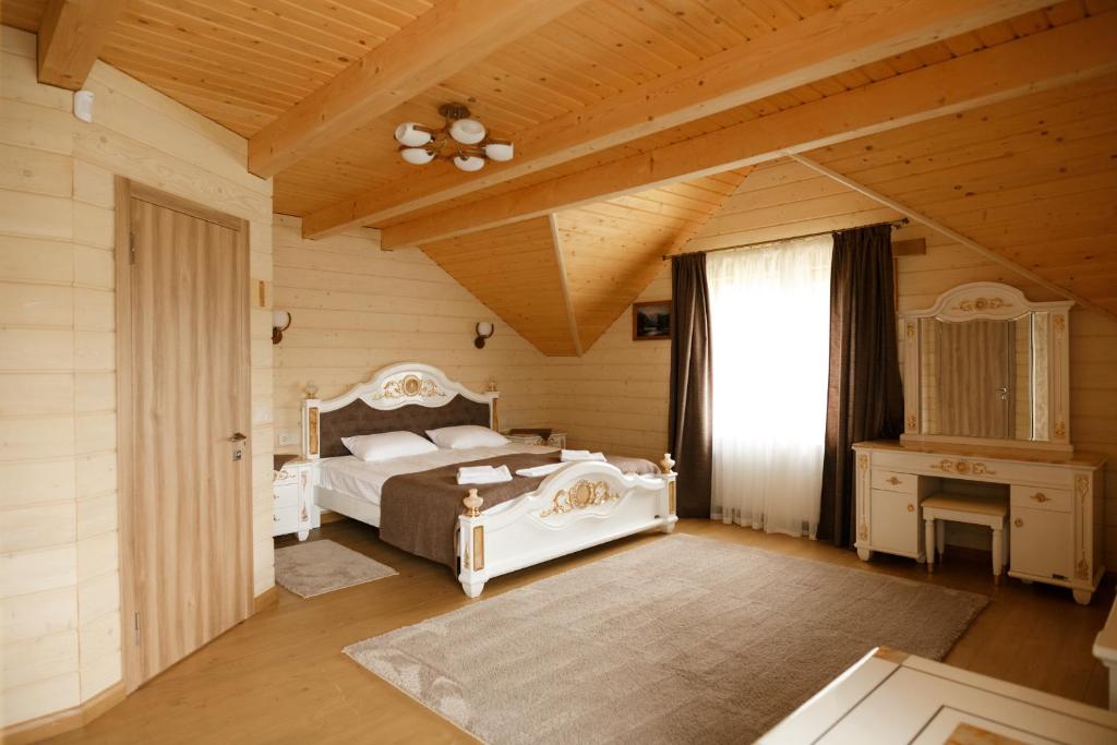 Postel nebo postele na pokoji v ubytování GUTSULWOOD