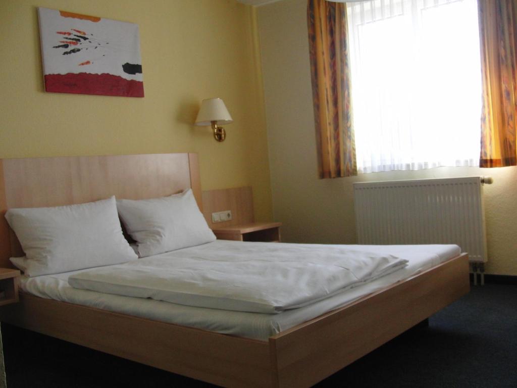 Postel nebo postele na pokoji v ubytování Hotel Angerer