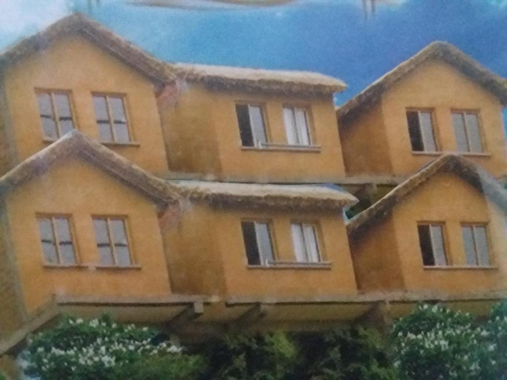 a painting of a house with windows at Las Cabañas Lodge in Isla de Sol