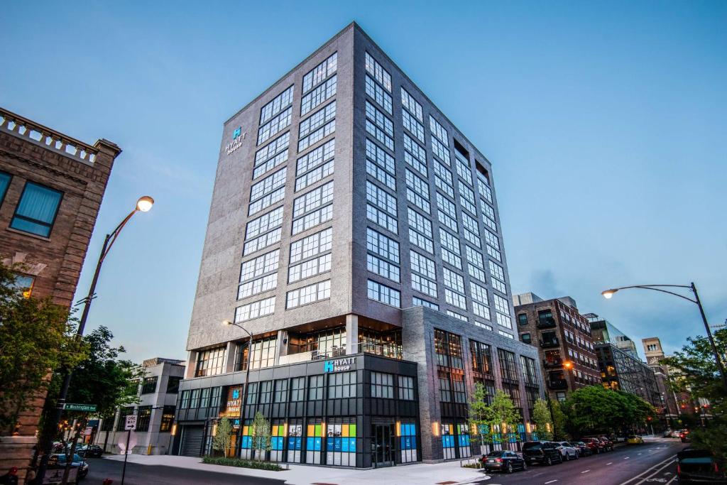 a tall building with many windows on a city street at Hyatt House Chicago West Loop in Chicago