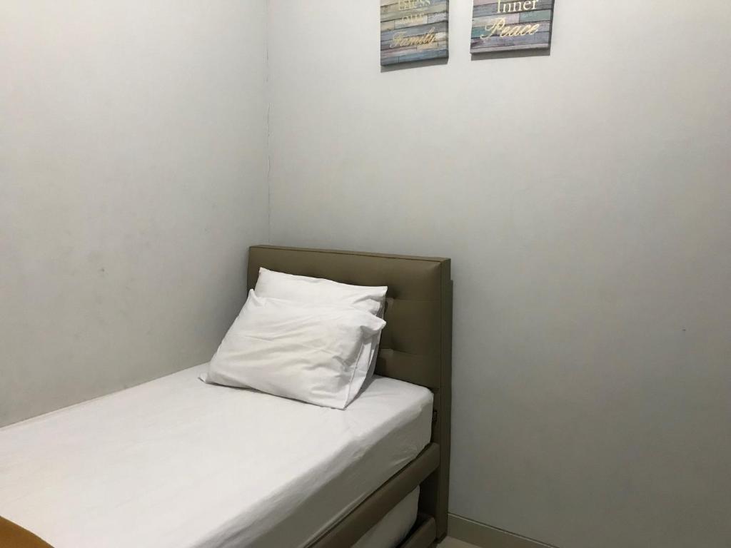 Postel nebo postele na pokoji v ubytování Naura Guest House