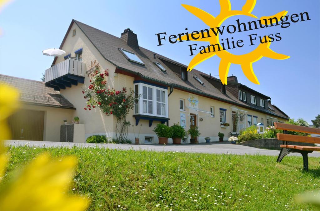 a house with the words featherholm farm elite fires at Ferienwohnungen Familie Fuss in Bischofsgrün