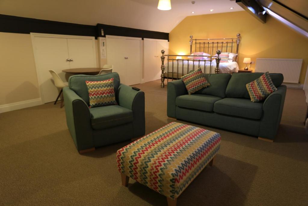 a living room with a couch and a chair at B+B York in York