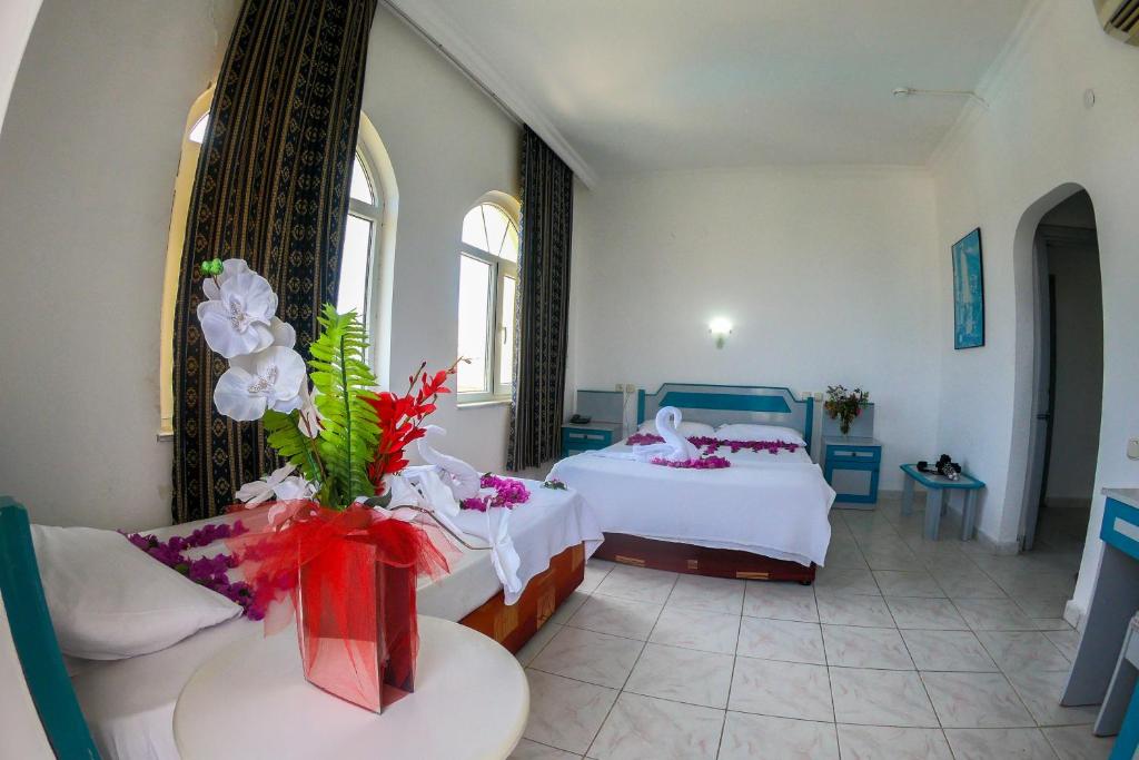 Postel nebo postele na pokoji v ubytování Marin Hotel