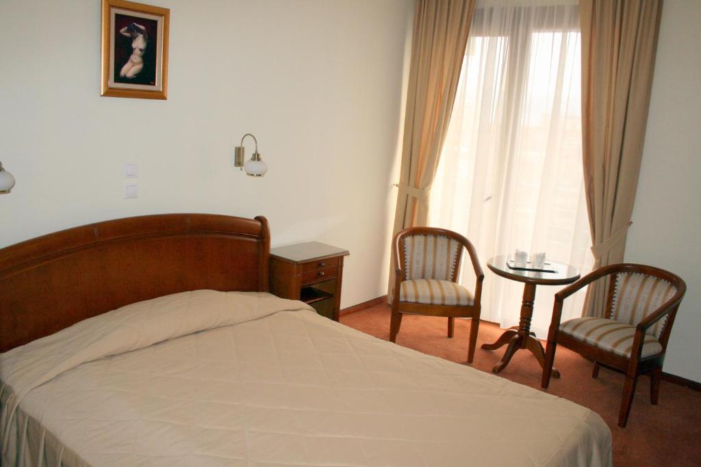 Postel nebo postele na pokoji v ubytování Hotel Sarmis