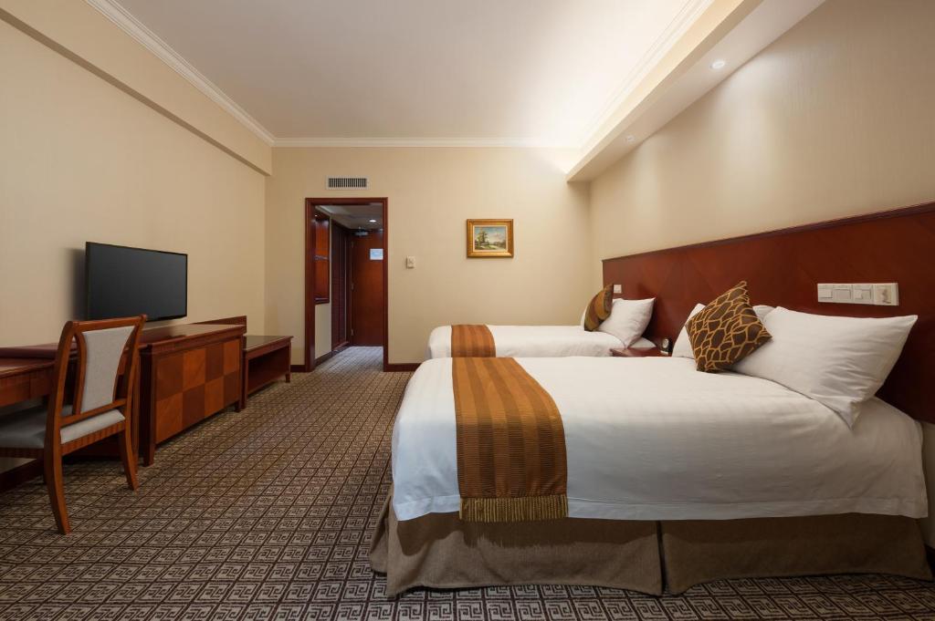 Postel nebo postele na pokoji v ubytování Ramada by Wyndham Pearl Guangzhou-Canton Fair Free Shuttle Bus