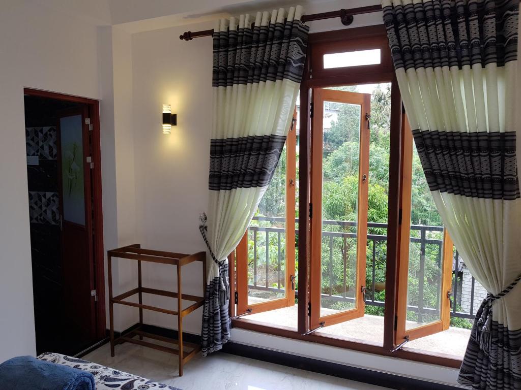 Postel nebo postele na pokoji v ubytování Kelum Homestay