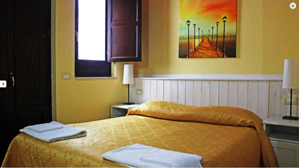 Postel nebo postele na pokoji v ubytování B&B Triskèles