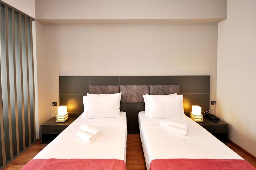 Postel nebo postele na pokoji v ubytování Jazz Hotel