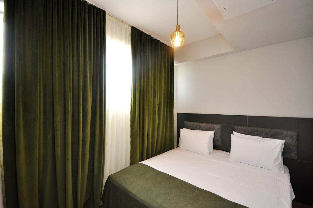 Postel nebo postele na pokoji v ubytování Jazz Hotel