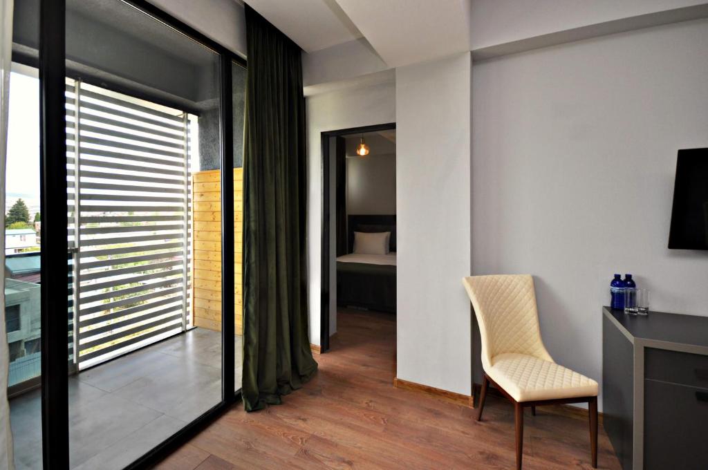 TV a/nebo společenská místnost v ubytování Jazz Hotel