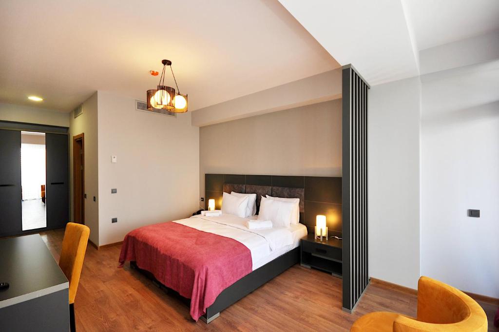 Postel nebo postele na pokoji v ubytování Jazz Hotel
