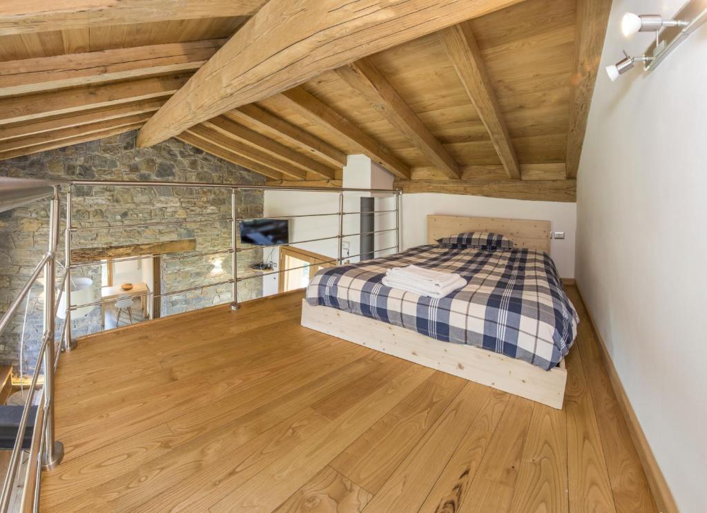 A bed or beds in a room at Albergo Diffuso Balcone sul Friuli
