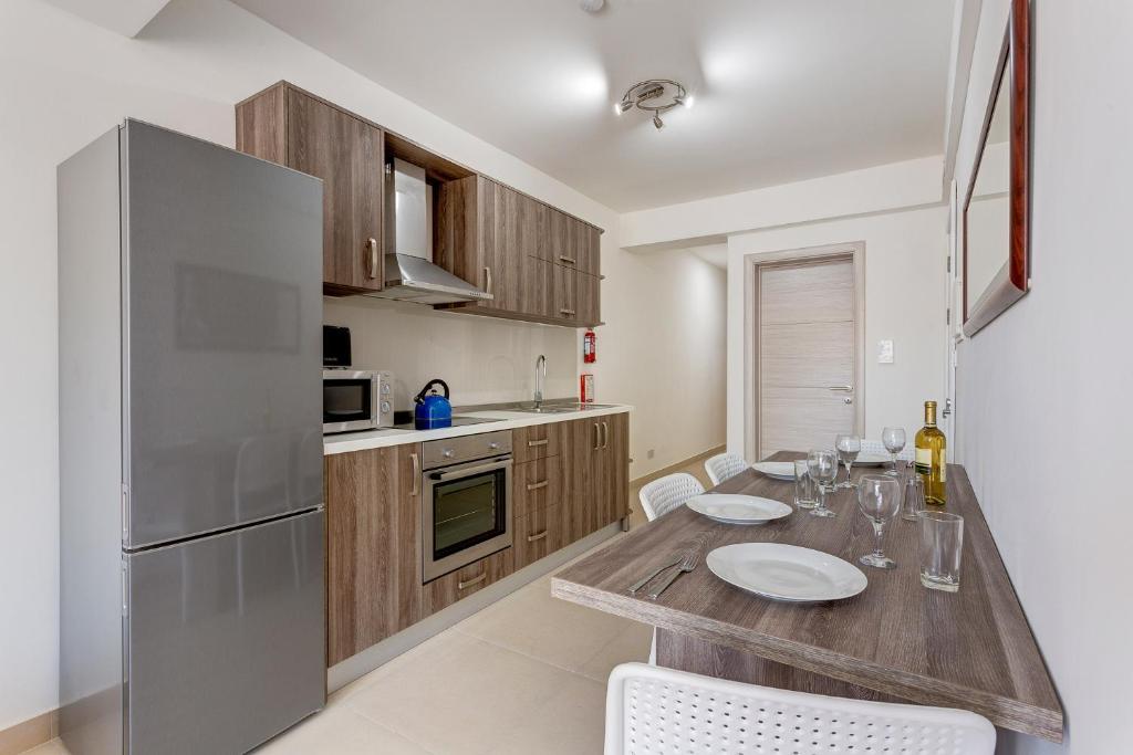 Kuchyň nebo kuchyňský kout v ubytování Harmony Apartments
