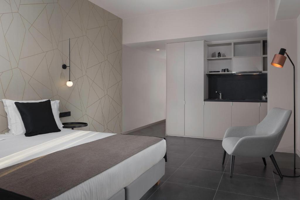 Posteľ alebo postele v izbe v ubytovaní Azur Suites