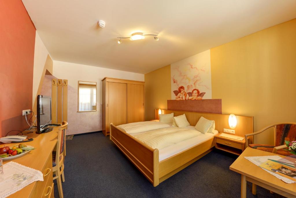Posteľ alebo postele v izbe v ubytovaní Hotel Flattacher Hof