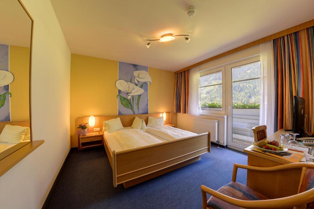 Posteľ alebo postele v izbe v ubytovaní Hotel Flattacher Hof