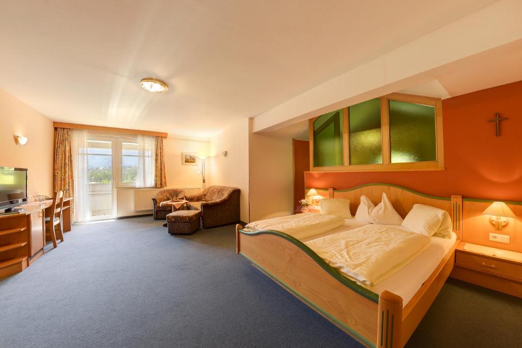 Posteľ alebo postele v izbe v ubytovaní Hotel Flattacher Hof