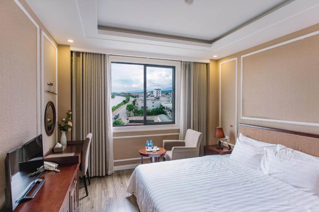 Postel nebo postele na pokoji v ubytování Cao Minh Hotel
